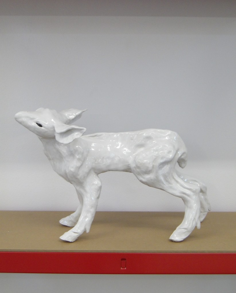 Standing ceramic deer sculpture