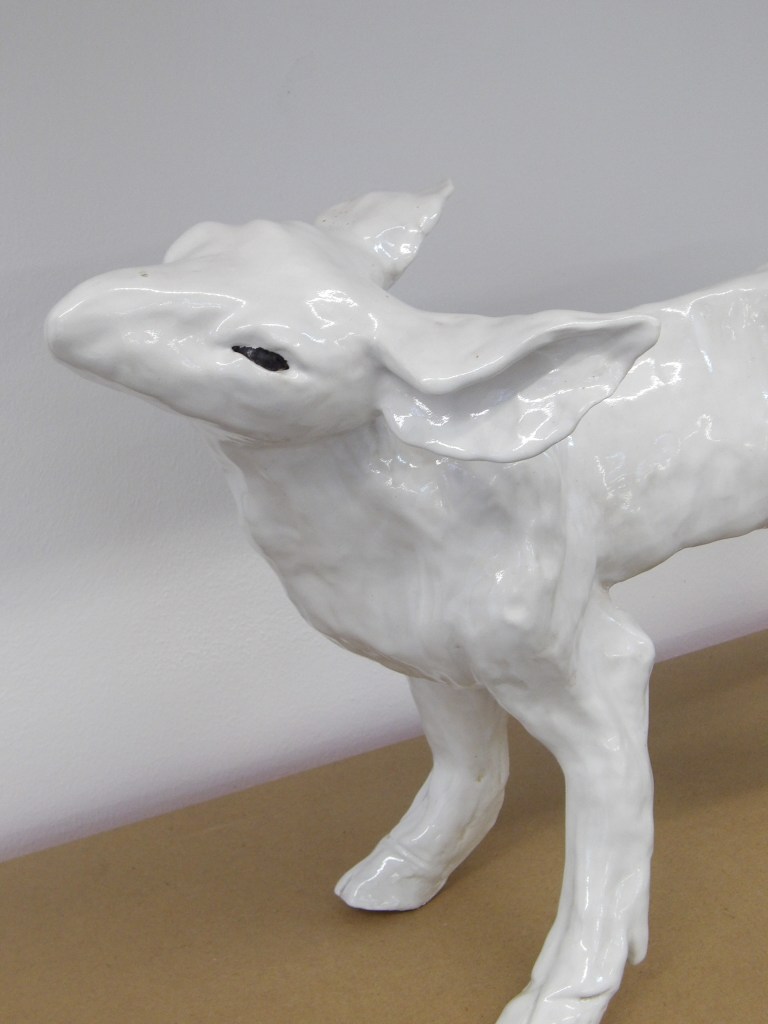 Standing ceramic deer sculpture