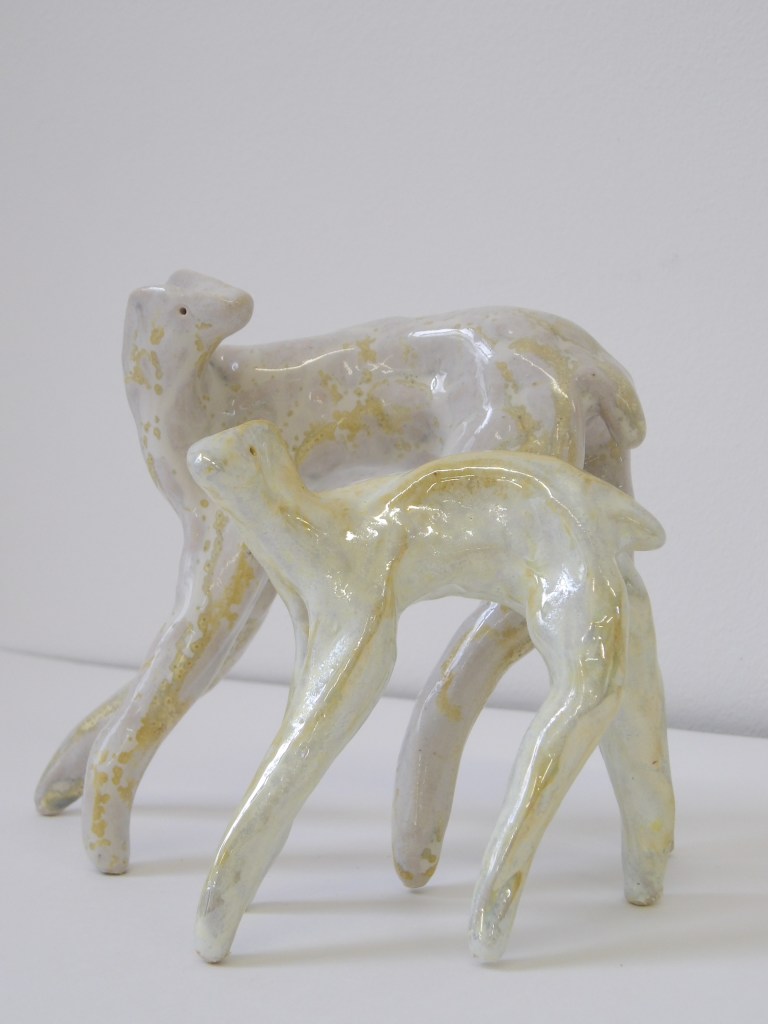 Pair of earthenware glazed ceramic deer figures