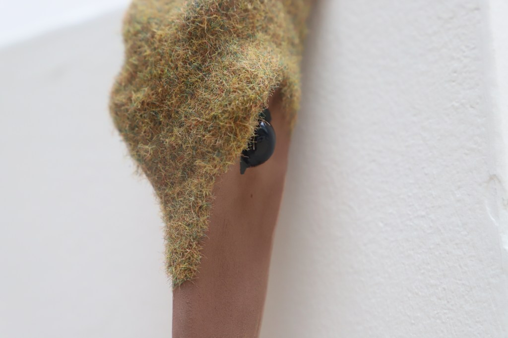 Flocked ceramic sculpture of a bird 