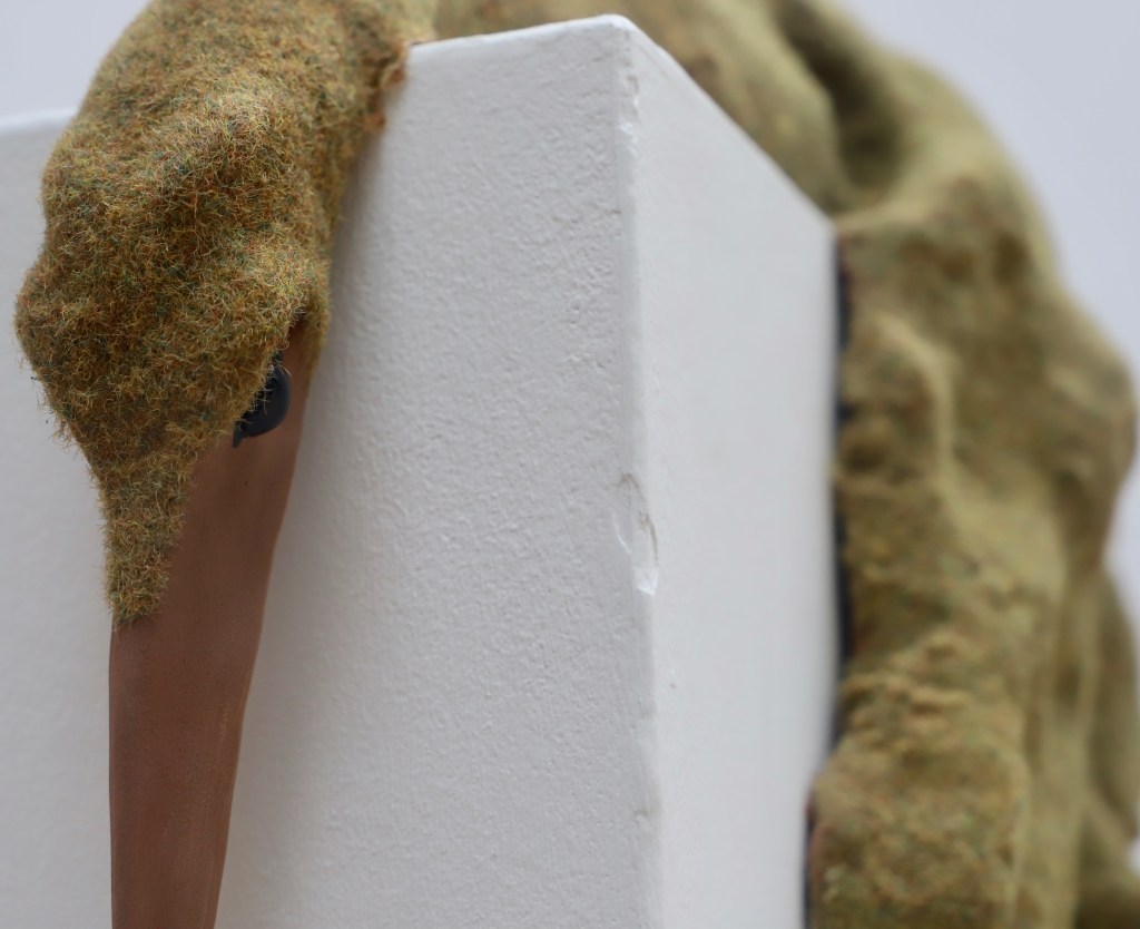 Flocked ceramic sculpture of a bird 