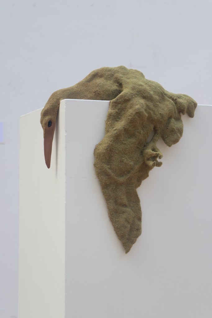 Flocked ceramic sculpture of a bird 