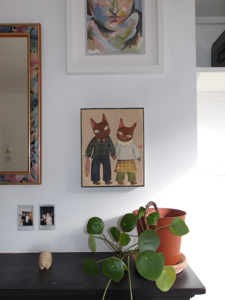 Painting of two cats on wooden canvas